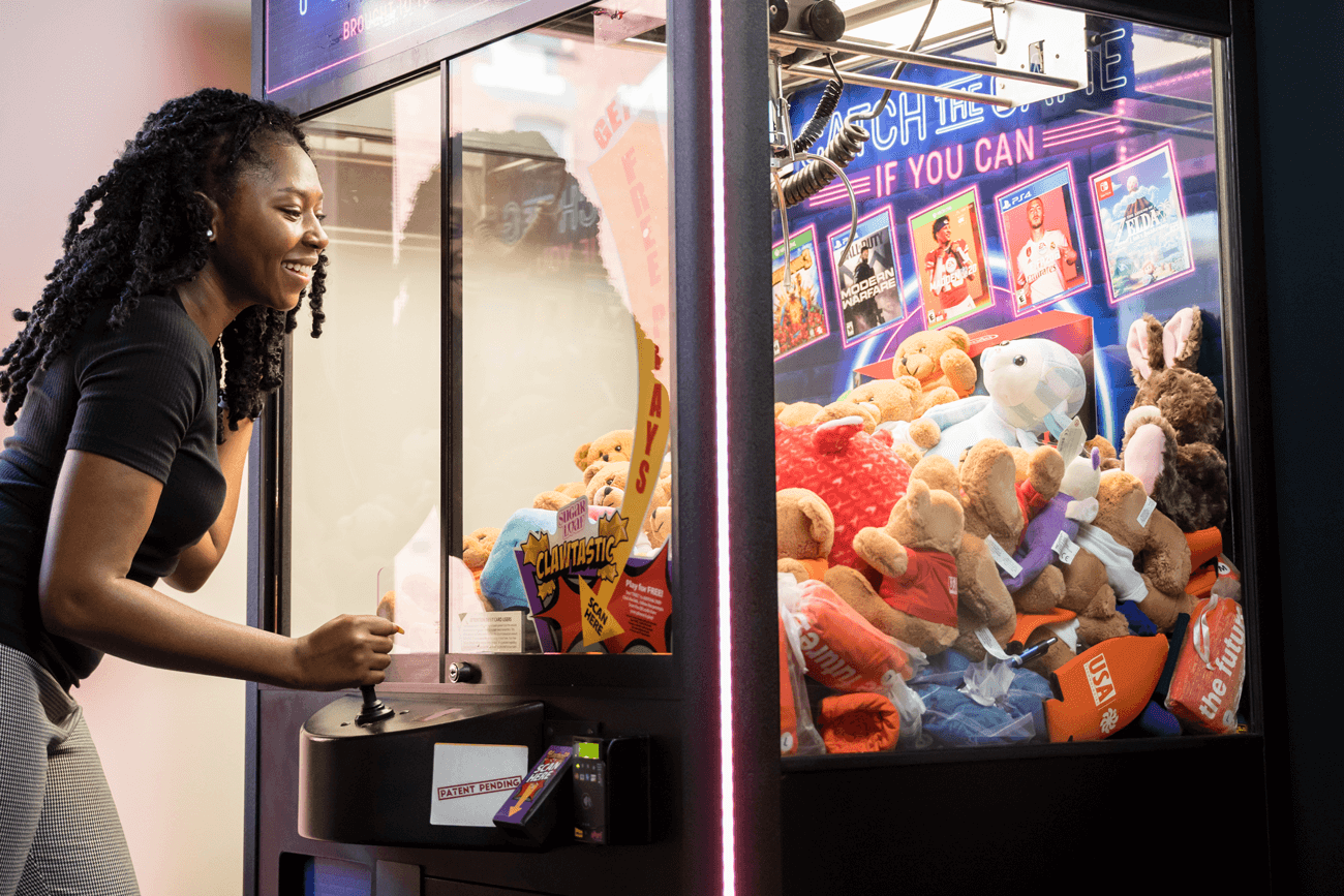 Girl playing arcade game